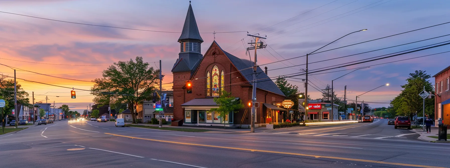 a church surrounded by commercial storefronts with a 